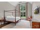 Spacious bedroom with vaulted ceilings, large windows, and a four poster bed at 129 Alder Springs Ln, Mooresville, NC 28117