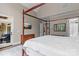 Serene bedroom with a four poster bed, tv, and an inviting covered terrace at 129 Alder Springs Ln, Mooresville, NC 28117