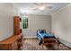 Cozy bedroom boasts wooden floors, a ceiling fan, and a window with natural light at 129 Alder Springs Ln, Mooresville, NC 28117