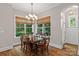 Formal dining room with wood floors and a large window, chandelier at 129 Alder Springs Ln, Mooresville, NC 28117