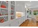 Bright kitchen with display cabinetry, marble countertops, and hardwood floors at 129 Alder Springs Ln, Mooresville, NC 28117