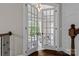A home office is entered through glass paneled double doors at 129 Alder Springs Ln, Mooresville, NC 28117