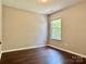 Simple bedroom featuring neutral walls and a window at 13913 Pinyon Pine Ln, Charlotte, NC 28215