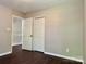 Bedroom with closet and an open door at 13913 Pinyon Pine Ln, Charlotte, NC 28215