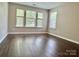 Bright, spacious bedroom features vinyl floors and large windows at 13913 Pinyon Pine Ln, Charlotte, NC 28215
