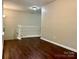 Hallway with wooden floor and white railings at 13913 Pinyon Pine Ln, Charlotte, NC 28215
