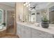 Bathroom featuring walk-in shower and white vanity with a double sink at 14515 Nolen Ln, Charlotte, NC 28277