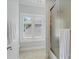 Bathroom featuring a shower with glass door and a window letting in natural light at 14515 Nolen Ln, Charlotte, NC 28277