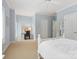 Bedroom featuring a desk, bed and bathroom entry, and a window with natural light at 14515 Nolen Ln, Charlotte, NC 28277