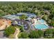 Aerial view of a community center with swimming pools, tennis courts and a playset at 14515 Nolen Ln, Charlotte, NC 28277