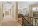 Hallway with railing overlooking living room at 14515 Nolen Ln, Charlotte, NC 28277