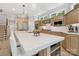 Well-lit kitchen with a large island, stainless steel refrigerator, and modern appliances at 14515 Nolen Ln, Charlotte, NC 28277