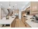Bright kitchen features a large island, stainless steel appliances, and stylish pendant lighting at 14515 Nolen Ln, Charlotte, NC 28277