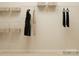 A functional closet features shelving units for ample storage and hanging space for clothing at 1516 Croydon St, Indian Land, SC 29707
