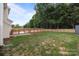 Backyard with deck, fence, and grassy yard at 1534 Piney Church Rd, Concord, NC 28025