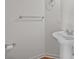 Half bathroom features pedestal sink, modern fixtures, and neutral walls at 1534 Piney Church Rd, Concord, NC 28025