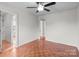 Bright bedroom with ceiling fan and doorway leading to additional rooms at 1534 Piney Church Rd, Concord, NC 28025