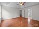 Spacious bedroom boasts ceiling fan, and doorway to ensuite bath at 1534 Piney Church Rd, Concord, NC 28025