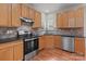 The kitchen includes stainless steel appliances, wood cabinets, and granite countertops at 1534 Piney Church Rd, Concord, NC 28025