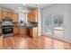 Well-lit kitchen features wooden cabinets, stainless steel appliances, and a sliding door leading to the deck at 1534 Piney Church Rd, Concord, NC 28025