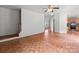 Open-concept living room with staircase, views of the kitchen, and natural light at 1534 Piney Church Rd, Concord, NC 28025