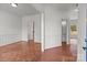 The spacious living room has a parquet floor, white walls, and decorative molding at 1534 Piney Church Rd, Concord, NC 28025