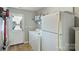 Functional laundry area with washer, dryer, refrigerator and convenient access to the outdoors at 15639 Sir Charles Pl, Charlotte, NC 28277