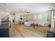 Open-concept living space featuring durable floors, modern furniture, and neutral paint at 15639 Sir Charles Pl, Charlotte, NC 28277