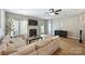 Open-concept living area featuring new floors, neutral decor, and a modern fireplace at 15639 Sir Charles Pl, Charlotte, NC 28277