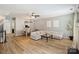 Bright living room features hardwood floors, modern decor, and a comfortable sectional sofa at 15639 Sir Charles Pl, Charlotte, NC 28277
