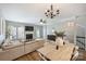 Open-concept living and dining area featuring neutral decor and durable floors at 15639 Sir Charles Pl, Charlotte, NC 28277