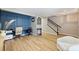 Open living space with durable floors, easy access to stairs, and office space at 15639 Sir Charles Pl, Charlotte, NC 28277
