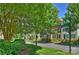 Picturesque street view featuring well-maintained townhouses and lush landscaping, creating curb appeal at 15639 Sir Charles Pl, Charlotte, NC 28277