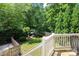 A lush backyard is seen from the deck, offering a beautiful outdoor space at 1638 Myers Park Dr, Charlotte, NC 28207