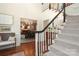 Inviting foyer with a staircase and a view into the dining room at 1638 Myers Park Dr, Charlotte, NC 28207
