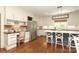 Spacious kitchen with stainless steel appliances, a large island, and a built-in desk area at 1638 Myers Park Dr, Charlotte, NC 28207