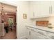 Pantry has ample storage space and a peek into the adjacent dining room at 1638 Myers Park Dr, Charlotte, NC 28207