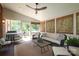Charming screened-in porch with seating and an adjacent deck overlooking the yard at 1638 Myers Park Dr, Charlotte, NC 28207