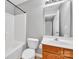 Standard bathroom with a shower-tub combo, white toilet, and wooden vanity at 1915 Travertine Ln, Fort Mill, SC 29708