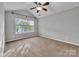 Spacious bedroom featuring carpet, and a window for natural light at 1915 Travertine Ln, Fort Mill, SC 29708