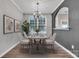 Bright dining room features modern chandelier and ample natural light from large window at 1915 Travertine Ln, Fort Mill, SC 29708
