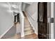 Welcoming entryway features hardwood floors, a staircase, and a stylish rug leading to the rest of the home at 1915 Travertine Ln, Fort Mill, SC 29708
