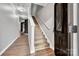 Welcoming entryway features hardwood floors, a staircase, and a stylish rug leading to the rest of the home at 1915 Travertine Ln, Fort Mill, SC 29708
