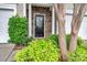 Inviting front door with stone accents, lush landscaping, and decorative columns create a warm and welcoming entrance at 1915 Travertine Ln, Fort Mill, SC 29708