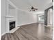 Spacious living room featuring hardwood floors, a fireplace, and ample natural light ideal for comfortable living at 1915 Travertine Ln, Fort Mill, SC 29708