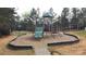 Community playground with slide, swings, and mulch at 1915 Travertine Ln, Fort Mill, SC 29708