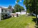 Large, well-maintained backyard with an established lawn, patio, and screened porch at 2008 Bantry Ln, Charlotte, NC 28262