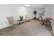 Basement featuring neutral carpet, finished stairs and accent tables with decor at 2008 Bantry Ln, Charlotte, NC 28262