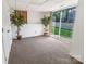 Spacious basement features neutral carpet, a window, and walk-out access to the backyard at 2008 Bantry Ln, Charlotte, NC 28262