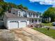 Traditional home boasting a three-car garage and welcoming front porch, perfect for relaxing at 2008 Bantry Ln, Charlotte, NC 28262